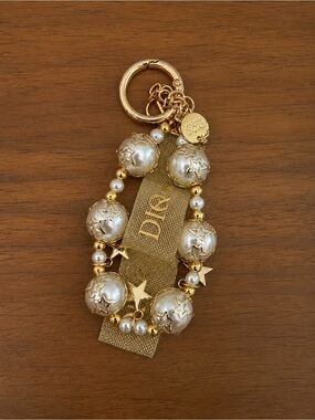 Brand new unopened Dior Gold Tone Key Chain Star Charm White Pearl Beaded